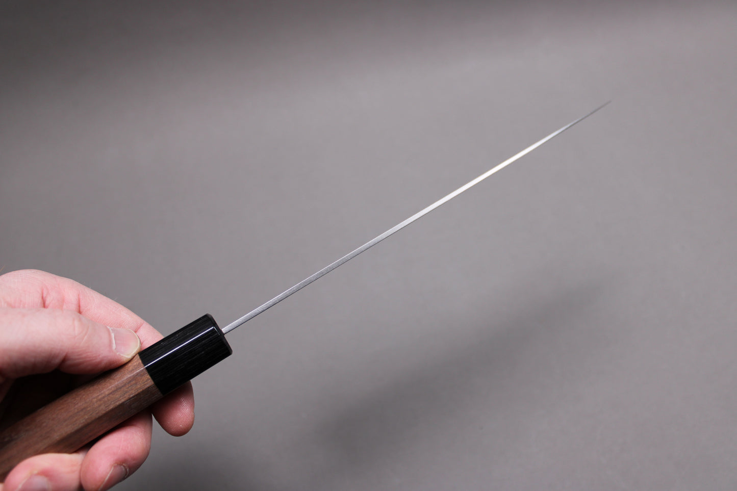 sakai kikumori 210mm gyuto showing distal tapering of knife spine