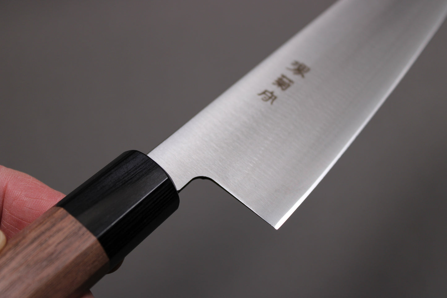 closeup shot of kawamura hamono kanji on 210mm gyuto