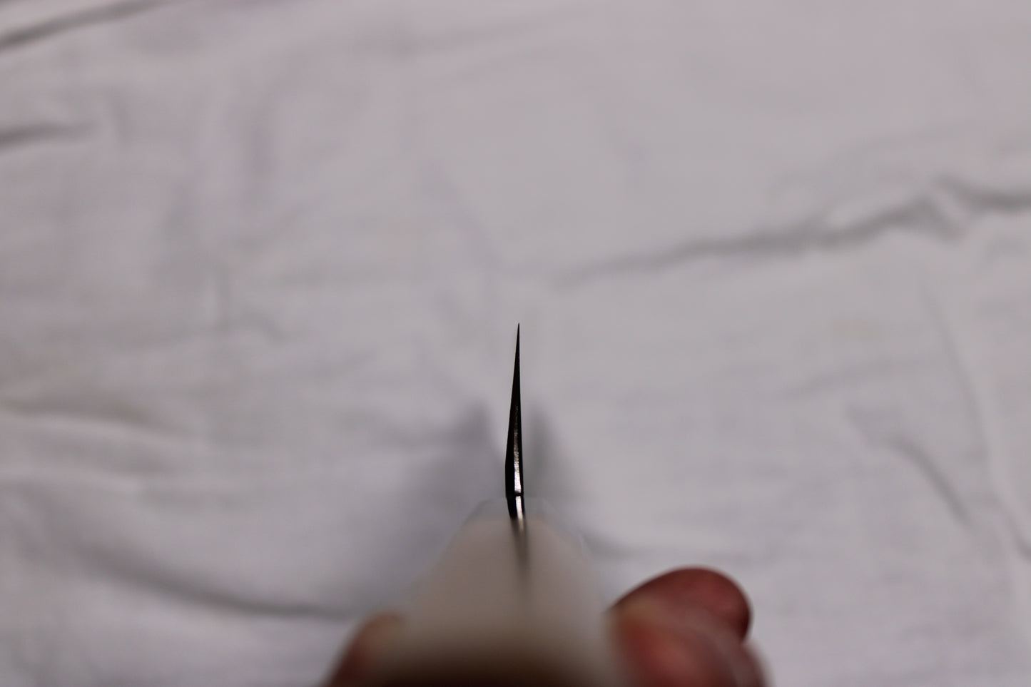 choil shot of 195mm single bevel usuba with very thin profile