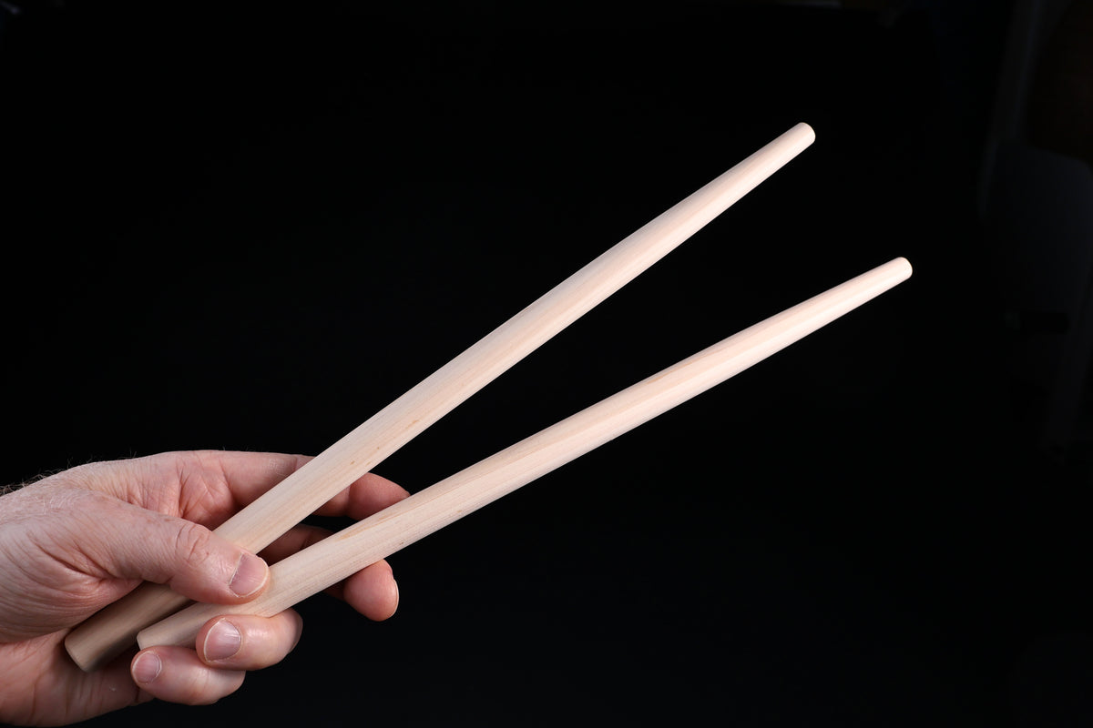 Hanabashi tempura chopsticks 36cm — held in hand showing grip position and tapered tips