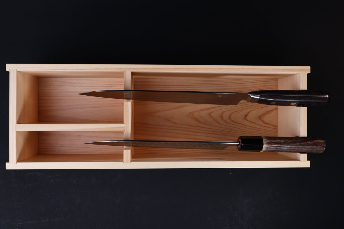 Hinoki knife stand box — overhead view with two Japanese knives stored showing compartment fit