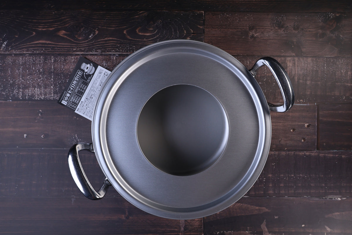 Hokuriku Aluminum steam ring — seated on double-handle pot, top view with black packaging