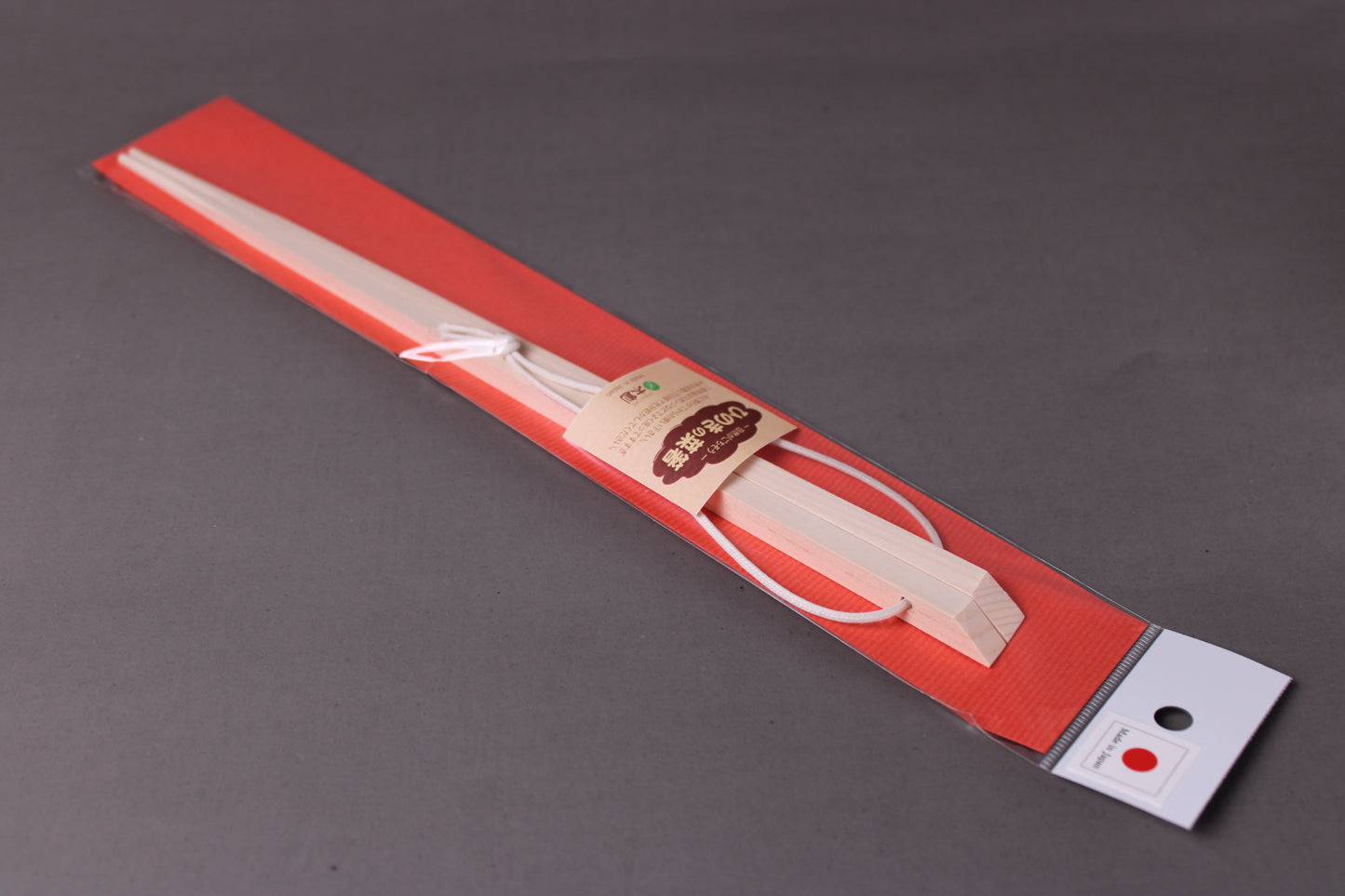 saibashi square cooking chopsticks by yamacoh youbi kisou life packed in clear plastic with red paper backing and sticker writing hinoki in hiragana with grey background closeup of package