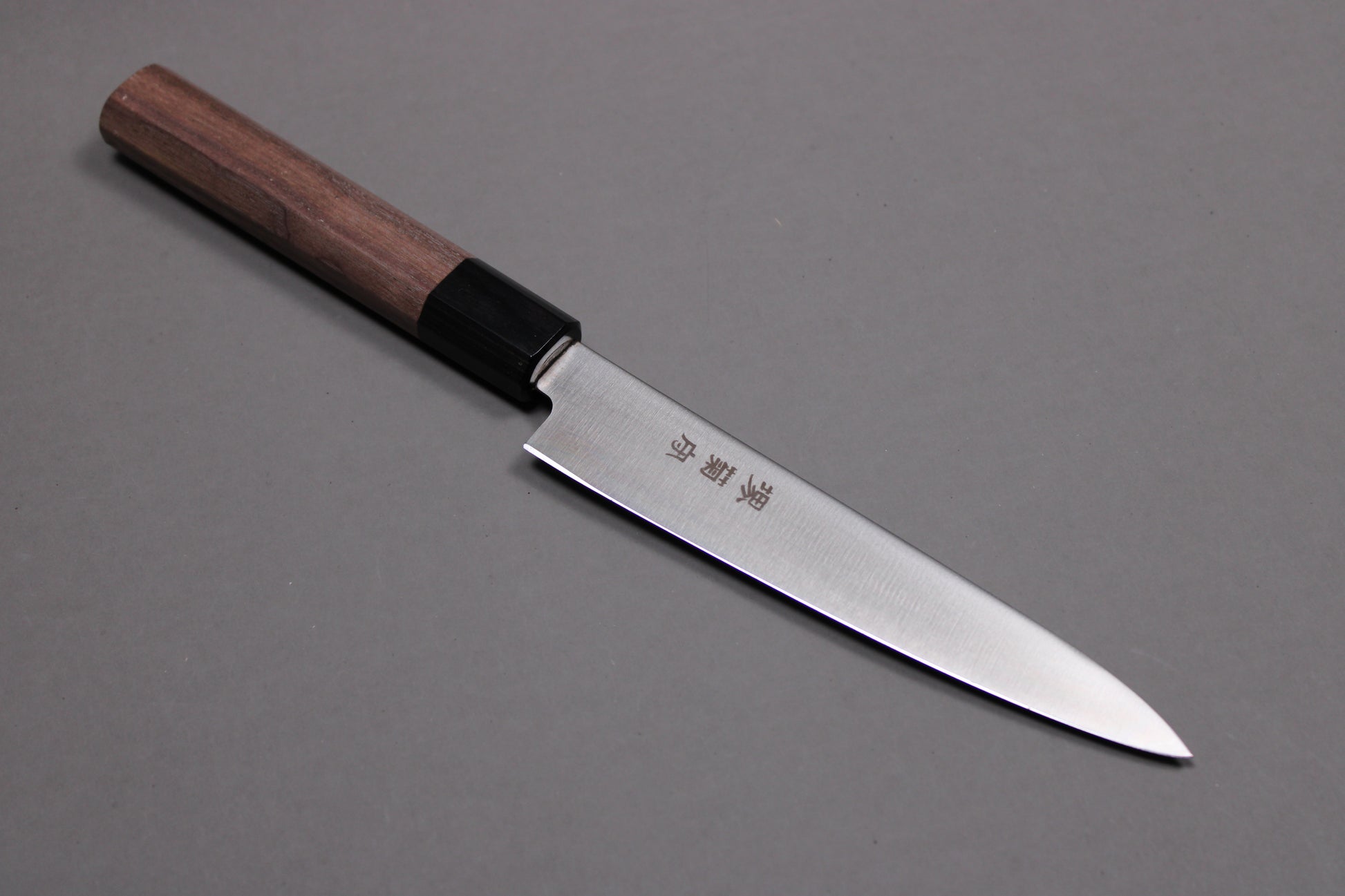 profile of sakai kikumori petty knife with rosewood octogonal handle
