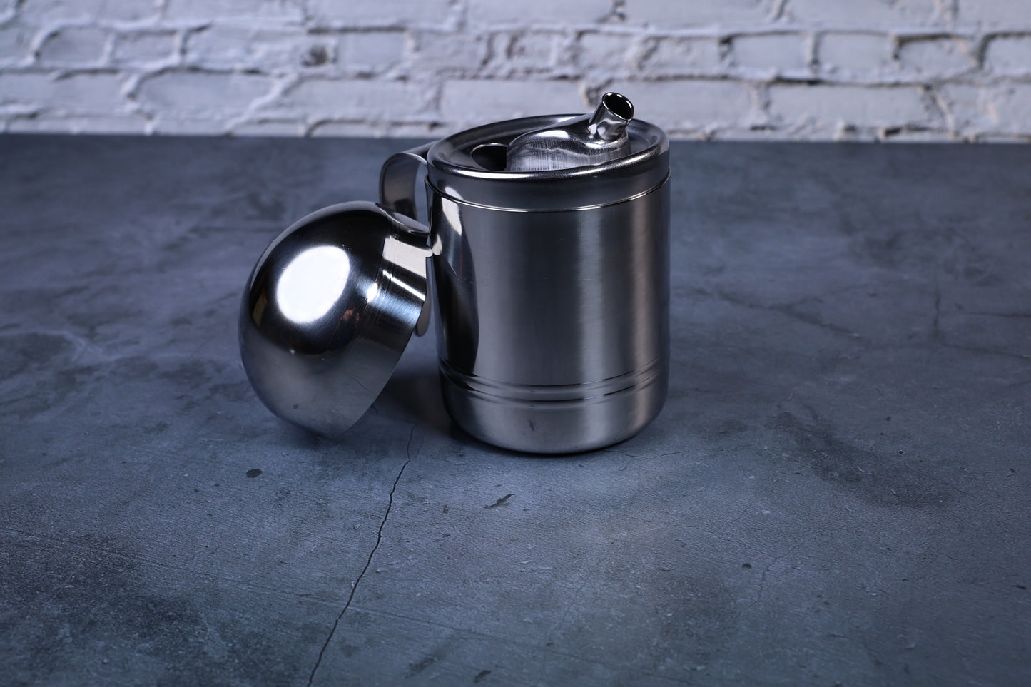 Stainless steel oil cruet small — front view lid removed showing inner spout detail and brushed steel body