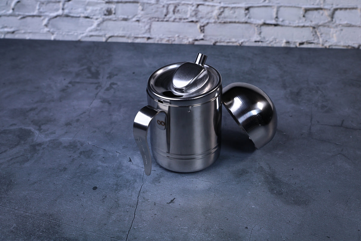 Stainless steel oil cruet small — dome lid removed showing inner pour spout and stainless body construction