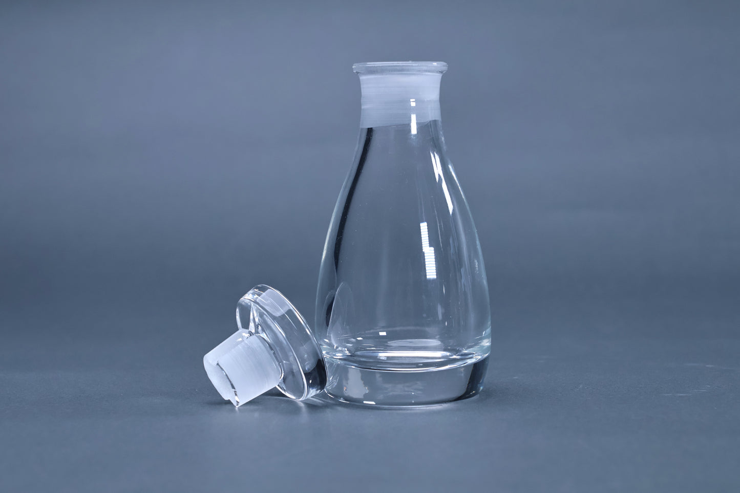 THE soy sauce cruet crystal glass body and stopper separated showing spout-free neck design