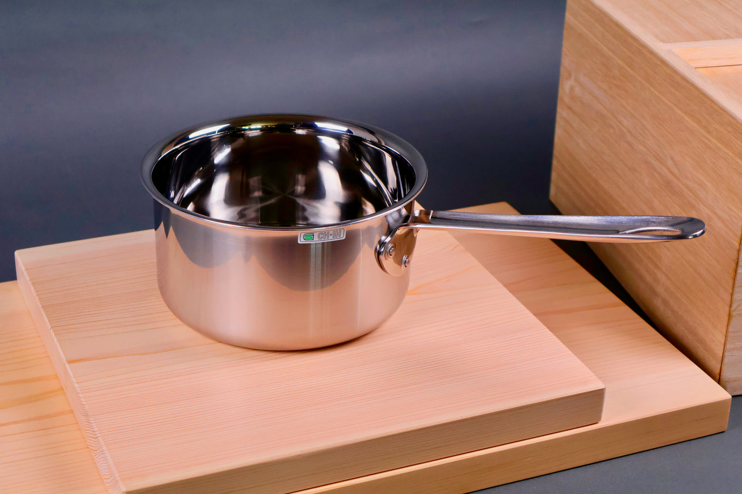 closeup shot of shiny steel curved lid for easy pouring
