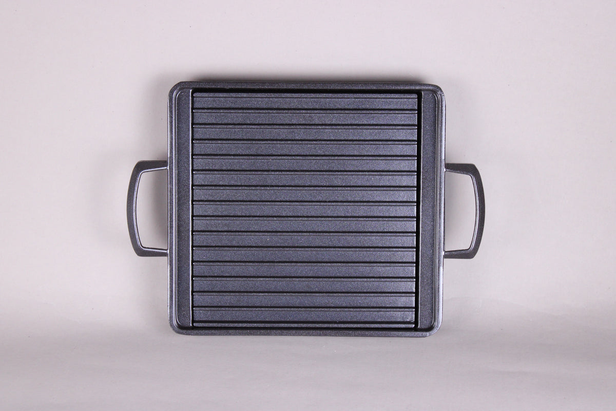 Yamacoh square grill — overhead view showing full ridged non-stick cooking surface and dual handles