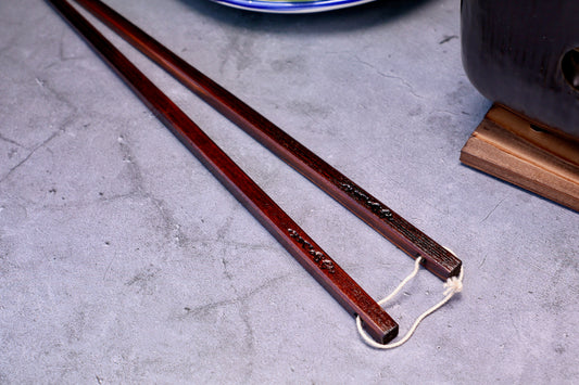 Yamacoh Suri Urushi Cooking Chopsticks Hinoki 33cm, close-up of kanji engraving and cotton twine tie at thick square end
