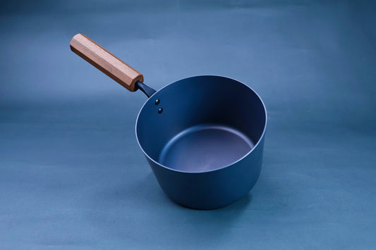 blue iron nitride steel with octagonal wood handle in bluish backdrop