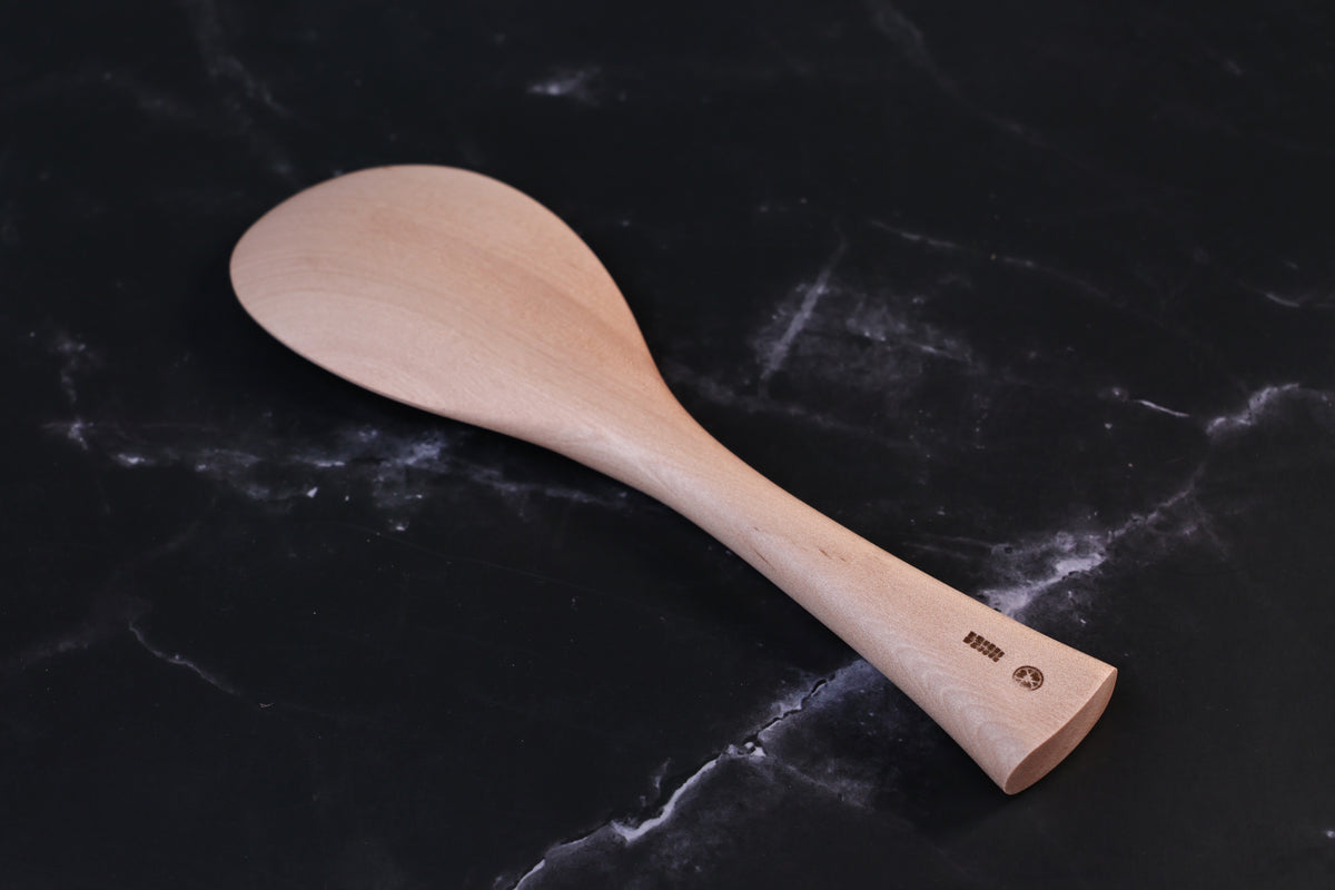 Azmaya handmade maple rice paddle showing the carved handle and burned-in maker&