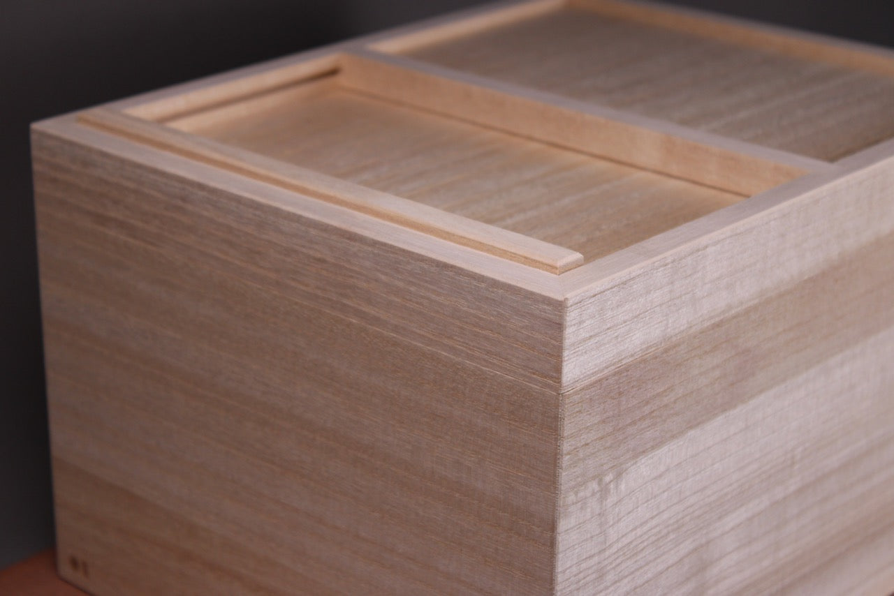 closeup shot of paulownia wood handmade rice bin sliding door made in japan by azmaya  
