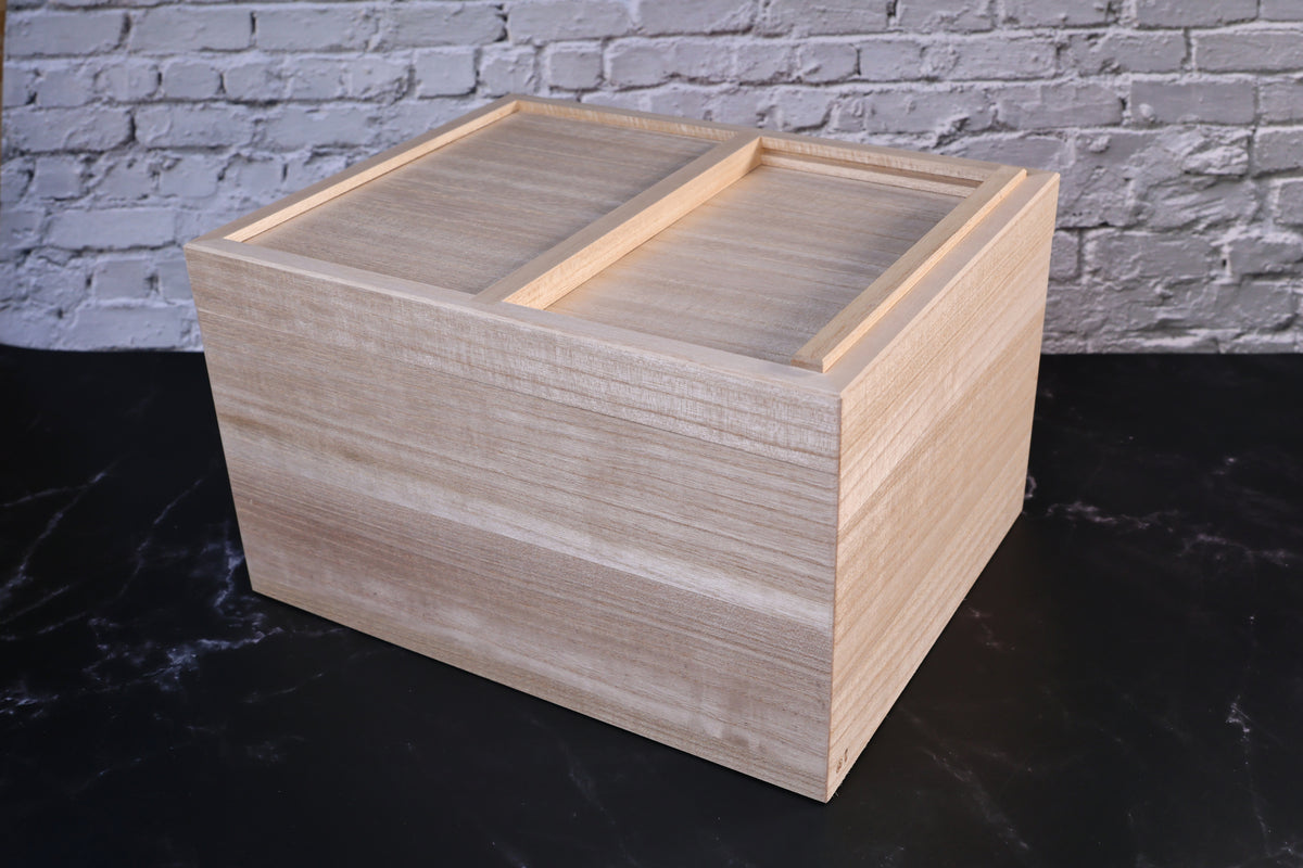 Azmaya kiri wood rice storage bin closed, shown at an angle with both sliding lid panels in place
