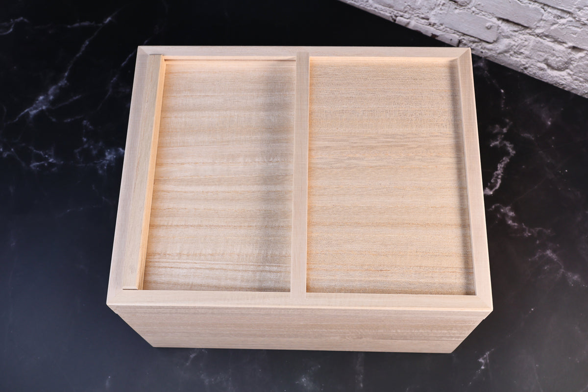 Overhead view of the Azmaya kiri wood rice bin fully closed, showing the two-panel sliding lid