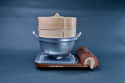 Bamboo steamer kit 21cm with dantsuki pot on Iwatani portable gas burner alternate angle showing hammered aluminum pot and cedar steamer body