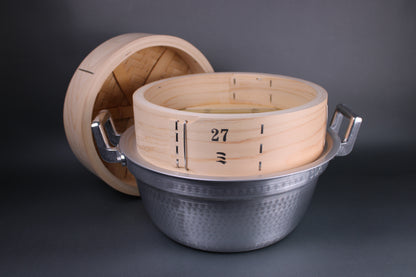 profile shot of bamboo steamer kit with steamer pot and steam ring lid removed against pot showing detail of raw wood product in grey background