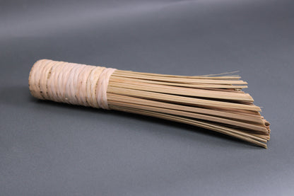 chan chee kee bamboo brush medium tan tone long bristles woven together bamboo strands hand made grey background 
