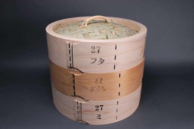 bamboo hinoki steamer stacked three high with lid middle and base with grey background