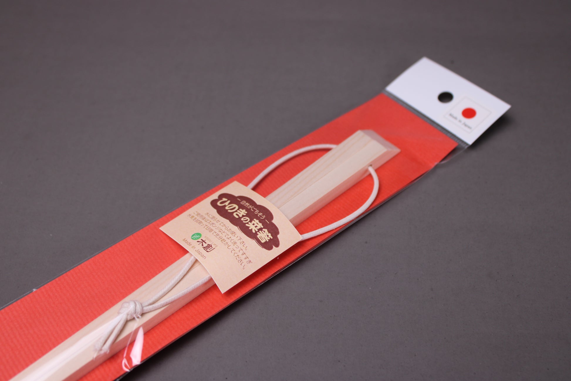 saibashi square cooking chopsticks by yamacoh youbi kisou life packed in clear plastic with red paper backing and sticker writing hinoki in hiragana with grey background closeup of chopsticks