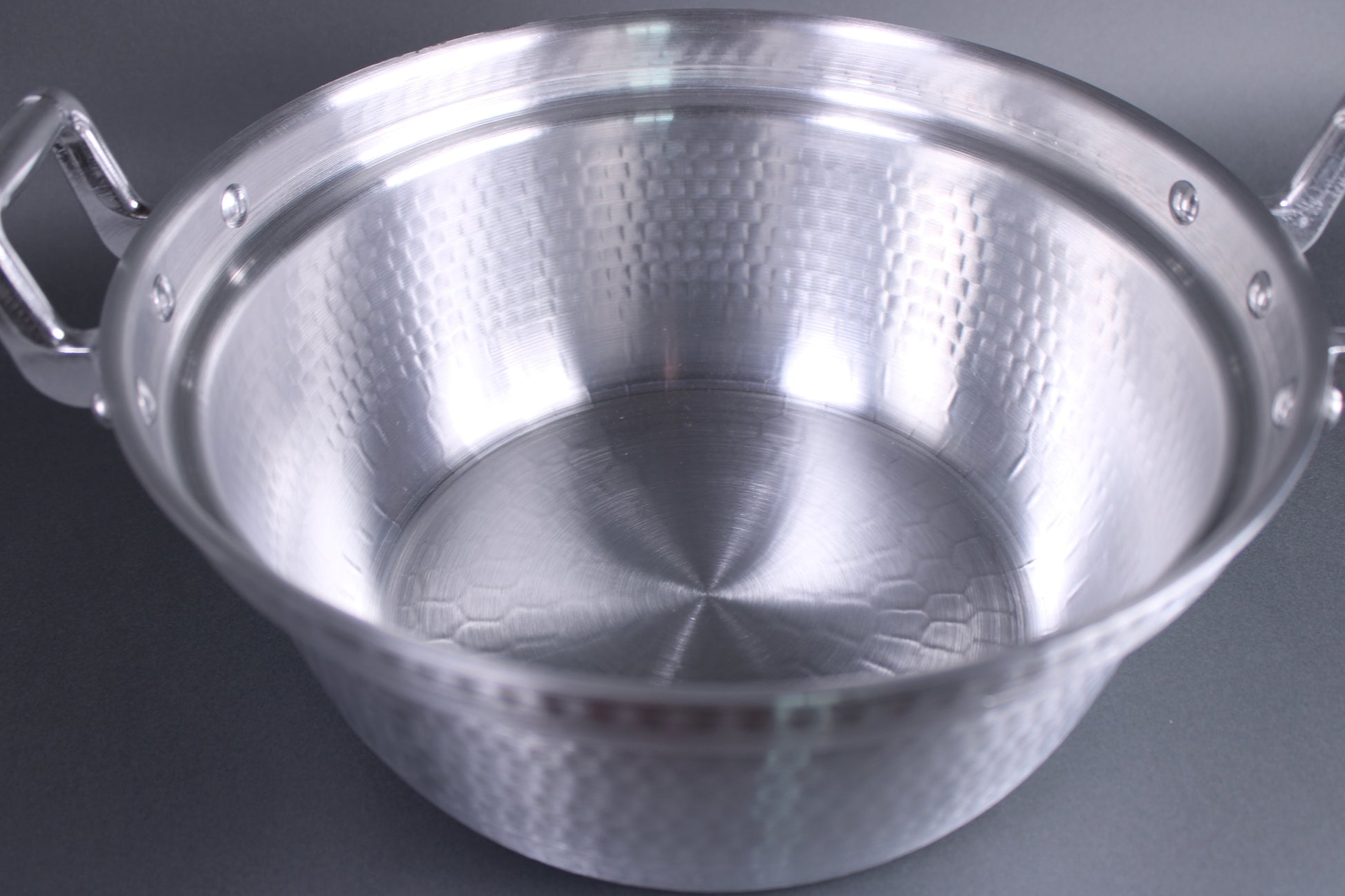 top view interior close up hammered texture surfaced pot for strength and heat distribution interior stepped ledge for steaming basket 