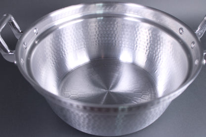 top view interior close up hammered texture surfaced pot for strength and heat distribution interior stepped ledge for steaming basket 
