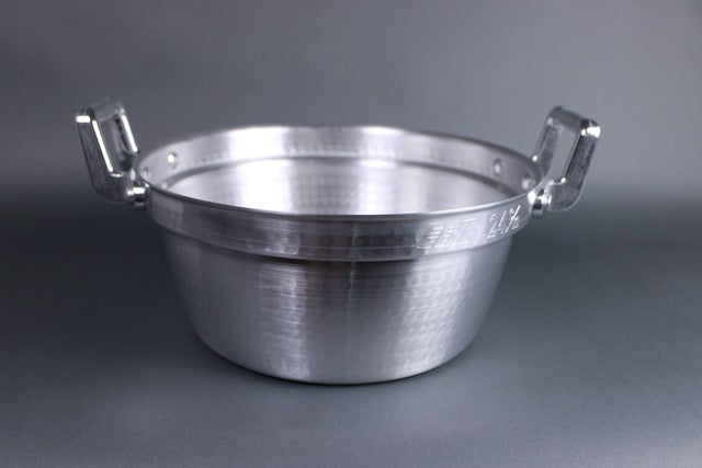  top view of seiro steaming pot showing interior hammered surface for strength and heat distribution custom interior ledge for team basket two handled pot with light grey background