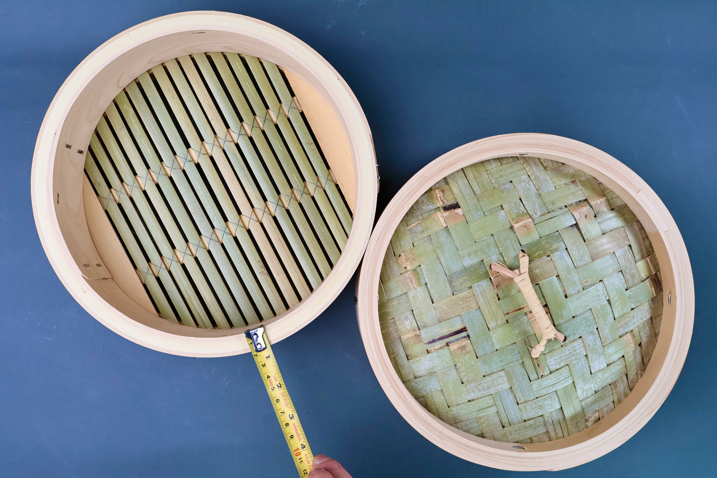 Overhead view of Ebematsu Shoji 27cm kiso hinoki bamboo steamer base and lid with tape measure showing internal diameter