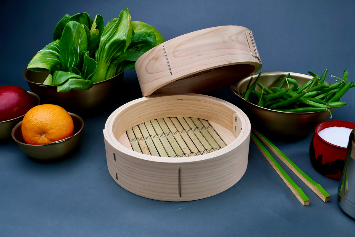 Ebematsu Shoji 21cm kiso hinoki bamboo steamer open with hinoki lid showing bamboo slat base interior styled with vegetables
