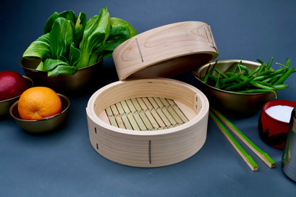 Ebematsu Shoji 21cm kiso hinoki bamboo steamer open with hinoki lid showing bamboo slat base interior styled with vegetables