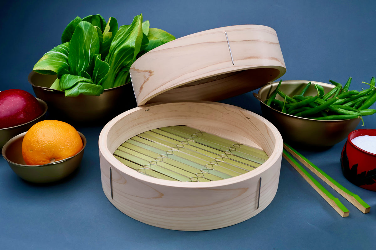 Ebematsu Shoji 27cm kiso hinoki bamboo steamer set open with hinoki lid showing bamboo slat interior styled with produce
