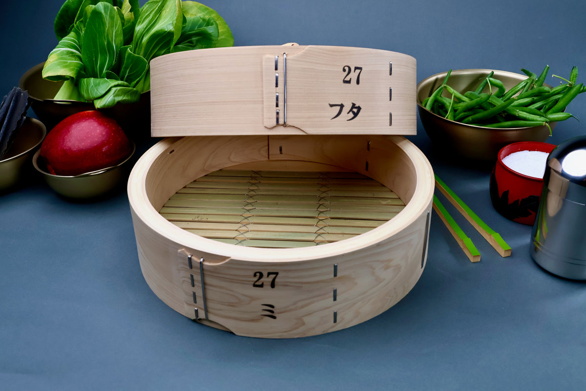 Ebematsu Shoji 27cm kiso hinoki bamboo steamer set open showing bamboo slat base interior styled with fresh vegetables