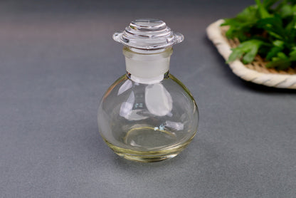 glass cruet japanese kitchenware short bulbous bottle spouted lid grey background