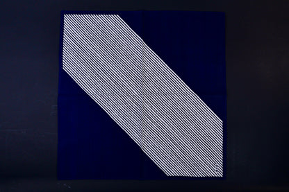 Hamamonyo classified stripes black tenugui fully unfolded on dark background, showing diagonal stripe design against solid navy
