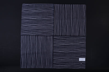 Hamamonyo tateyoko striped tenugui fully unfolded on black background, showing four-panel stripe pattern variation