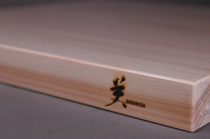 detailed shot of hinoki wood cutting board showing grain pattern and hanabusa logo and beveled edges silk finish surface 