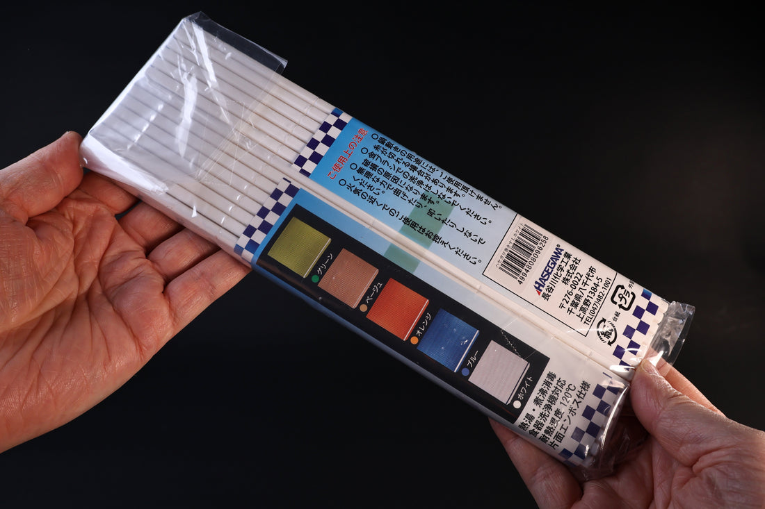 Back of the Hasegawa white sushi rolling mat size L package showing the color options and care information