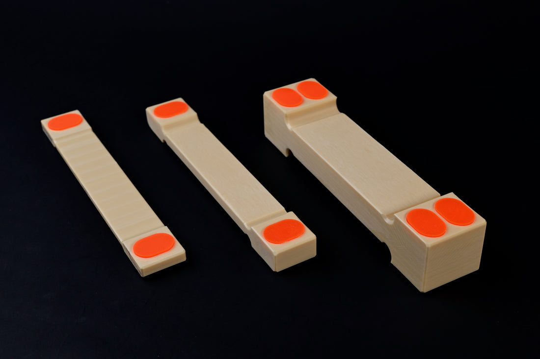 Hasegawa cutting board lifter — all three sizes at diagonal showing small medium and large body width comparison
