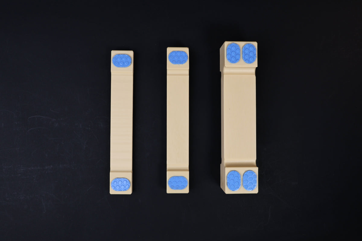 Hasegawa cutting board lifter — all three sizes laid flat showing width and grip pad differences