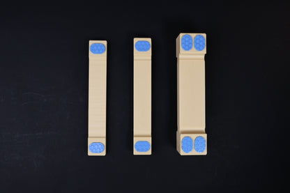 Hasegawa cutting board lifter — all three sizes laid flat showing width and grip pad differences