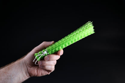 Hayakawa sasara fish cleaning brush — bristle end and crimped plastic texture held in hand