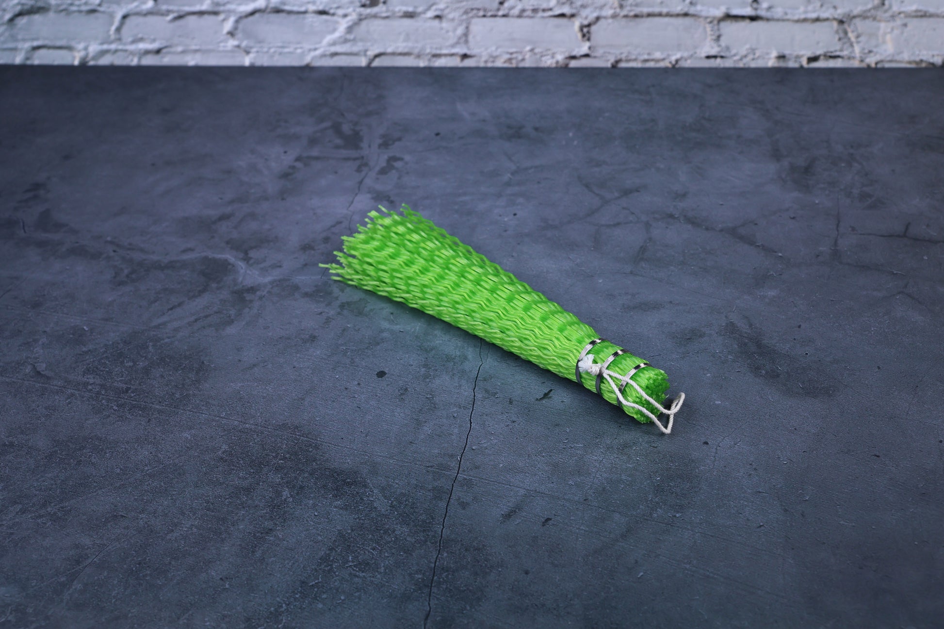 Hayakawa sasara fish cleaning brush — full view showing crimped bristle end and wire-bound handle