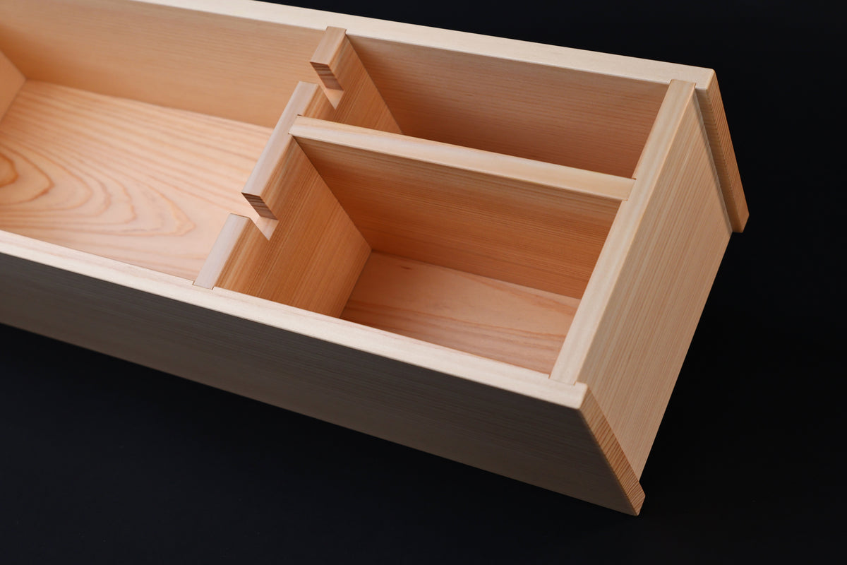 Hinoki knife stand box — close-up of interior divider and finger joint construction detail
