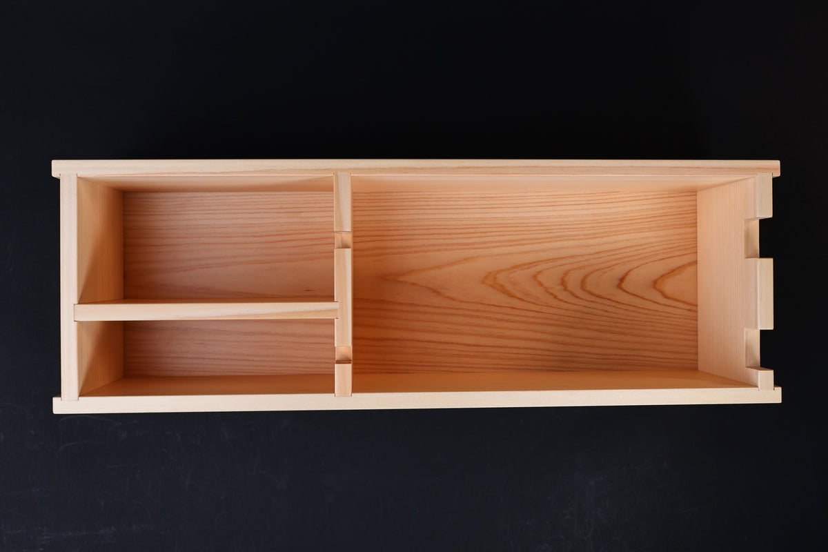 Hinoki knife stand box — overhead view of interior showing compartment layout and hinoki wood grain