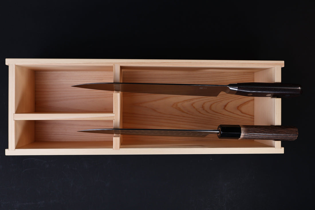 Hinoki knife stand box — overhead view with two Japanese knives stored showing compartment fit
