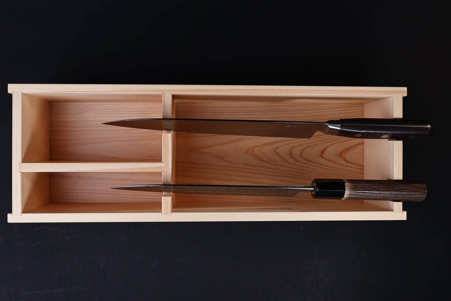 Hinoki knife stand box — overhead view with two Japanese knives stored showing compartment fit