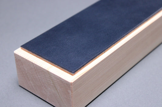 Hinoki midnight leather knife strop — corner detail showing hinoki wood grain and leather edge construction