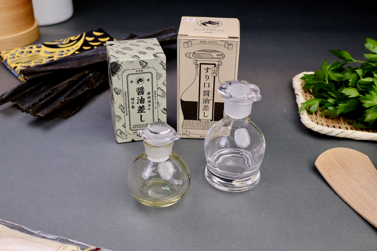 hirota glass company products cruets and product boxes with animated containers hiragana company logo grey background