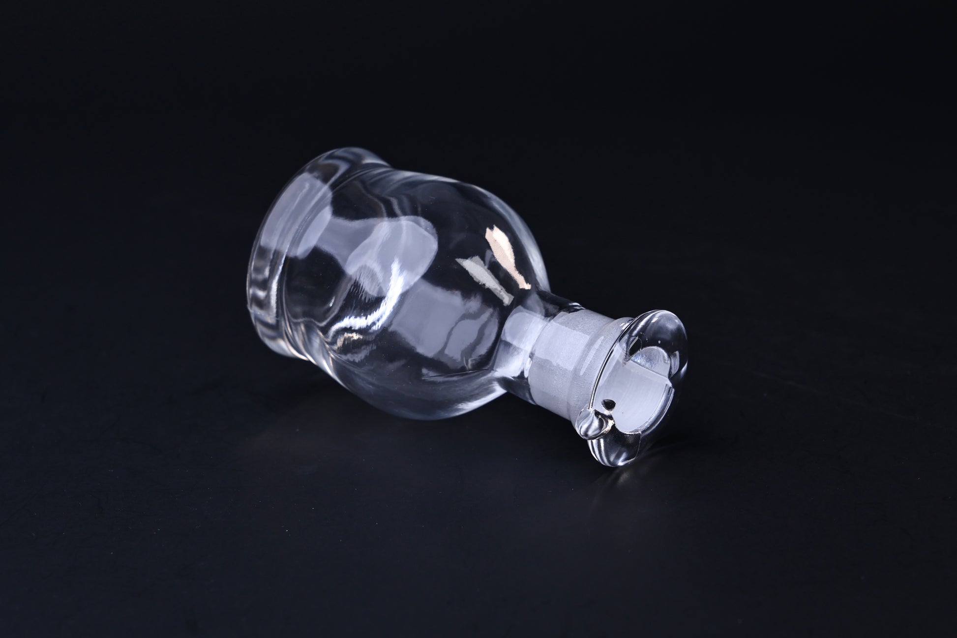 Hirota Glass soy sauce cruet — angled view showing rounded body form and stopper detail
