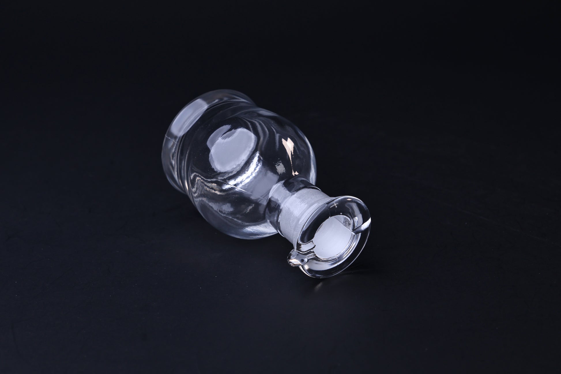 Hirota Glass soy sauce cruet — tilted view showing ground glass stopper and pouring spout
